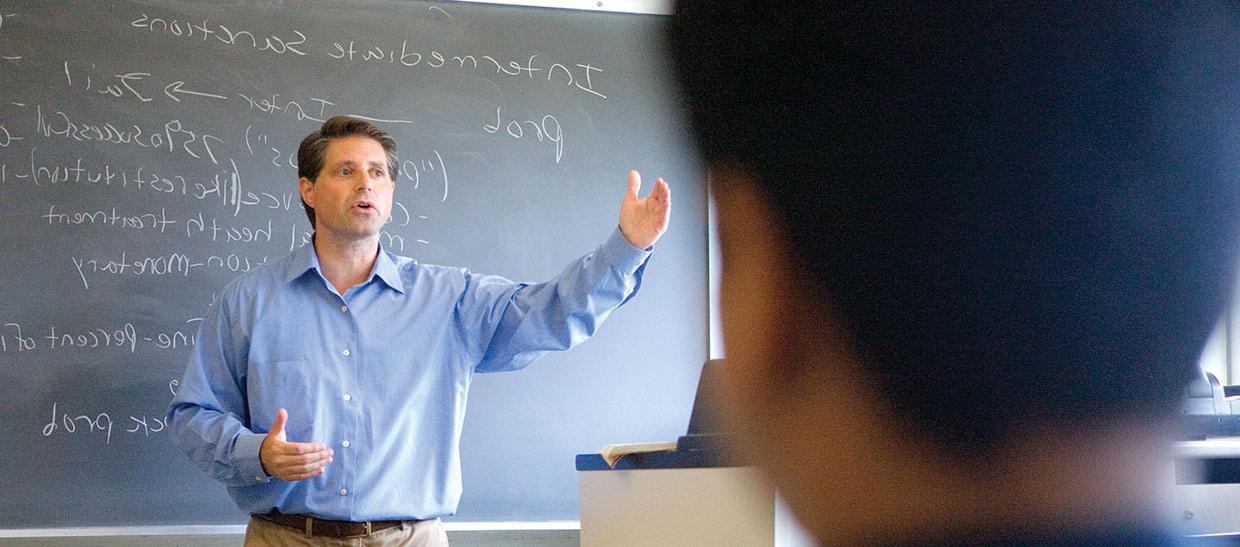 Professor teaching in front of class